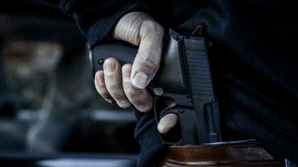 zamach, pistolet